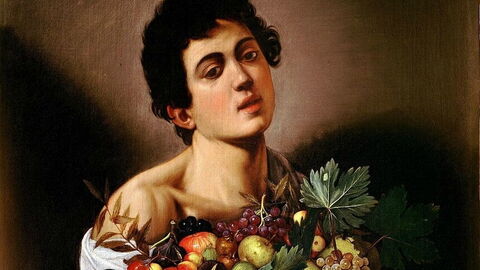 garçon et panier de fruits