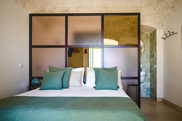chambre à coucher du trullo-emmebi