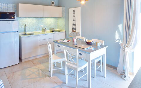 Golfo Aranci Ortensia Apartments: Pièce, Meubles, Propriété, Bleu, Cuisine, Design Intérieur, Sol, Bâtiment, Maison, Table