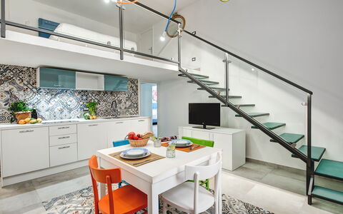 Loft In Sorrento: Meubles, Cabinetry, Propriété, Comptoir, Table, Cuisine, Orange, Éclairage, Design Intérieur, Chaise
