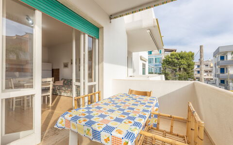Apartment Living In Baia Verde - Gallipoli: Propriété, Table, Bâtiment, Bleu Azur, Bois, Design Intérieur, Éclairage, Architecture, Chaise, Sol