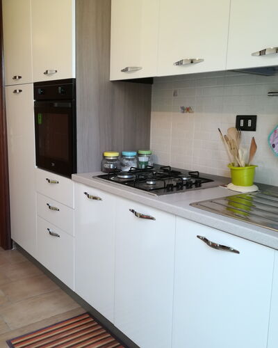 Villa Maddalena: Cuisine, Principaux Appliance, Appareil De Cuisine, Comptoir, Le Fourneau, Cuisinière, Sol, Cabinetry, Électroménager, Gaz Poele